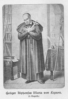 Der heilige Alfons steht im Ordensgewand in seiner Stube, die Hände an der Brust gekreuzt und das Kruzifix haltend.